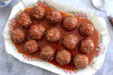 Homemade meatballs in tomato sauce on a platter