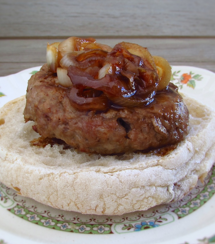 Burger with caramelized onion with a bread slice