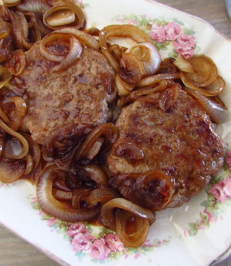 Burger with caramelized onion in a platter