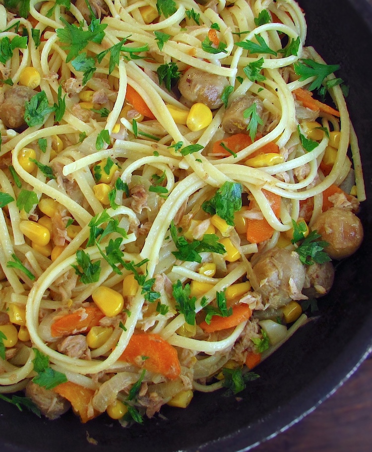 Spaghetti with tuna, corn and mushrooms in a frying pan