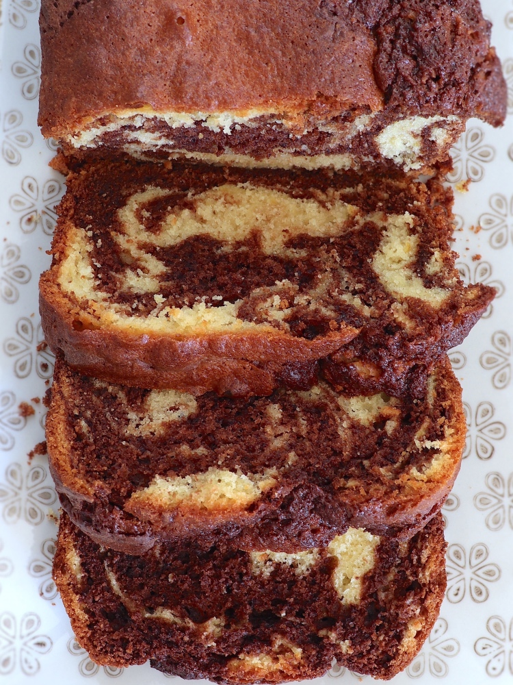 Slices of easy chocolate lemon marble loaf cake on a rectangular platter