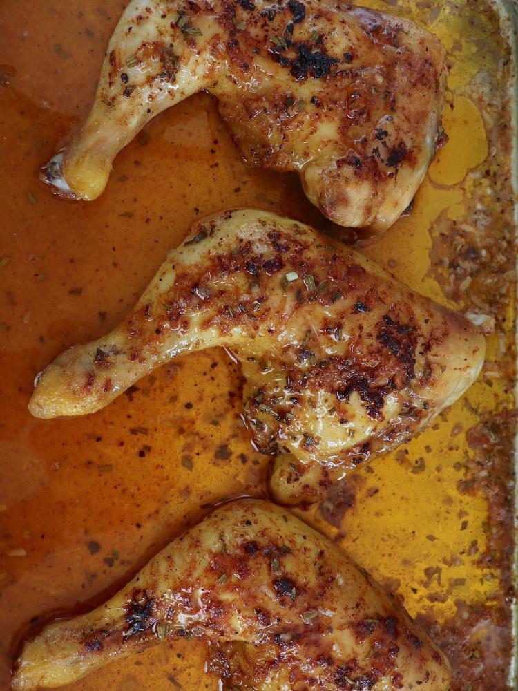 Spicy Roasted Chicken leg Quarters in a baking sheet
