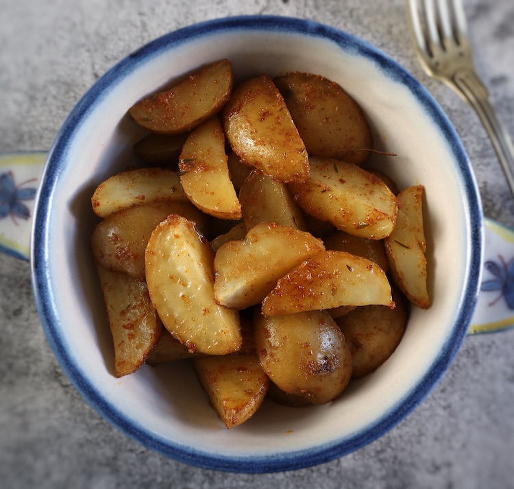 The Best Oven Roasted Potatoes on a small tureen