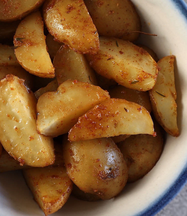 The Best Oven Roasted Potatoes on a small tureen